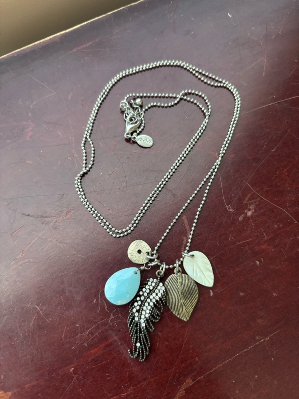 Silver-Tone Multi Charm Necklace with Blue Teardrop and Leaf Pendants